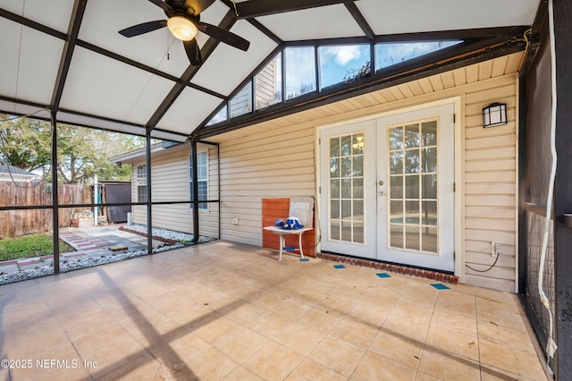 unfurnished sunroom with french doors, ceiling fan, and vaulted ceiling