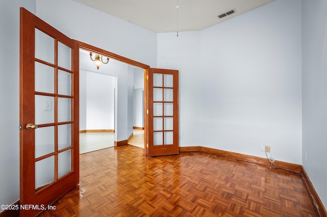 spare room featuring french doors and parquet floors