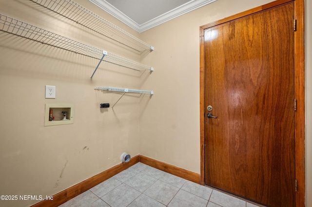 laundry room with crown molding, washer hookup, hookup for an electric dryer, and light tile patterned floors