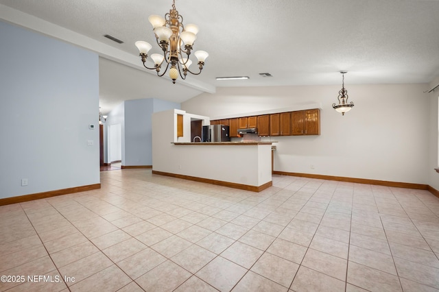 interior space with lofted ceiling with beams, light tile patterned flooring, a notable chandelier, and a textured ceiling