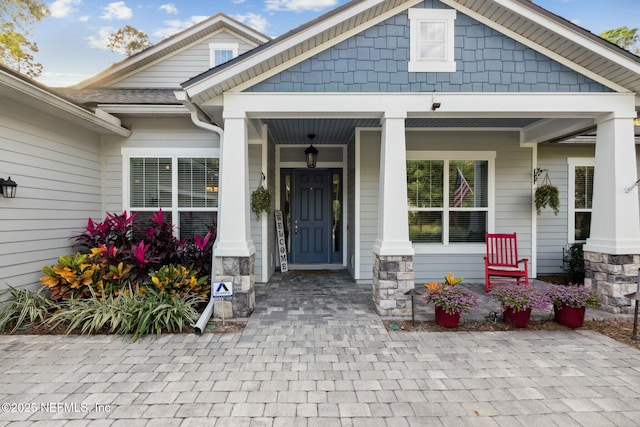 entrance to property with a porch