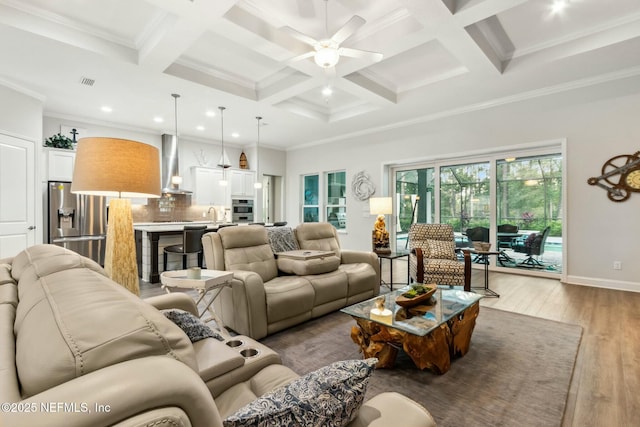 living room with beam ceiling, light hardwood / wood-style flooring, ceiling fan, and coffered ceiling