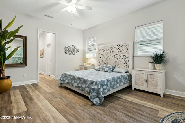 bedroom featuring wood-type flooring and ceiling fan