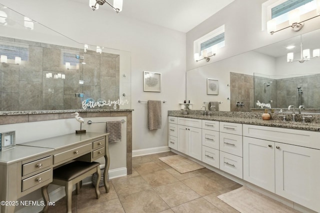 bathroom featuring vanity and a tile shower