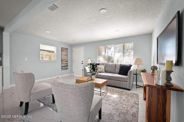 living room featuring a textured ceiling