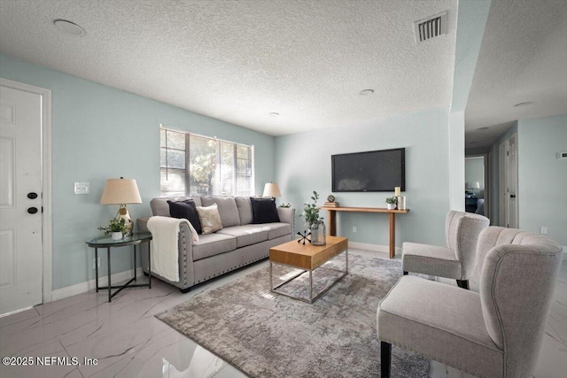 living room with a textured ceiling