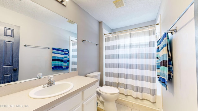 full bathroom featuring vanity, tile patterned floors, toilet, a textured ceiling, and shower / tub combo