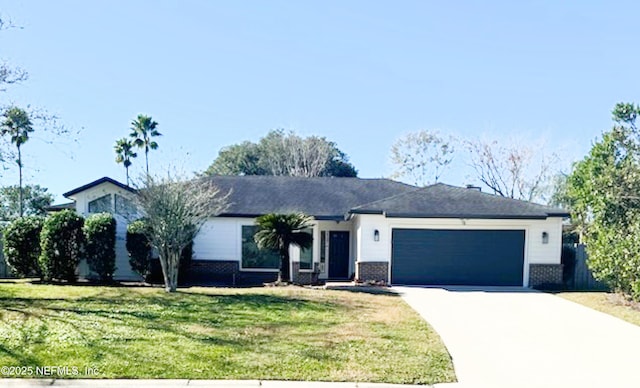 ranch-style home featuring a garage and a front yard