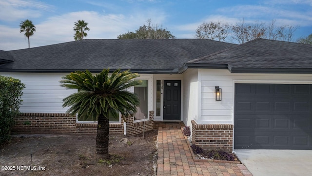 ranch-style house featuring a garage