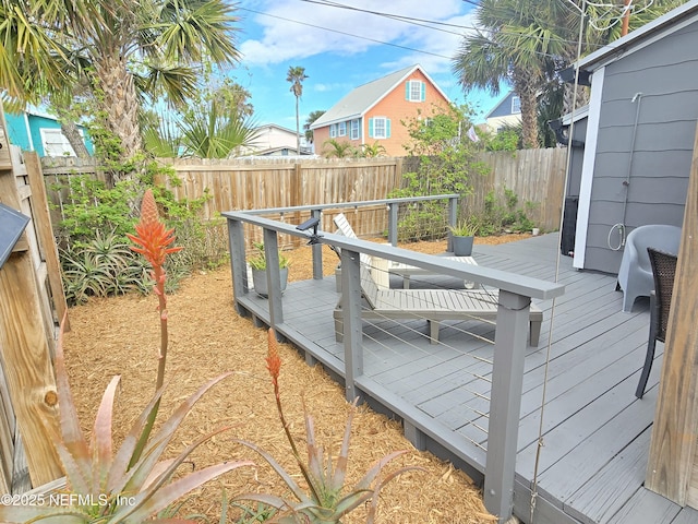 deck with a fenced backyard