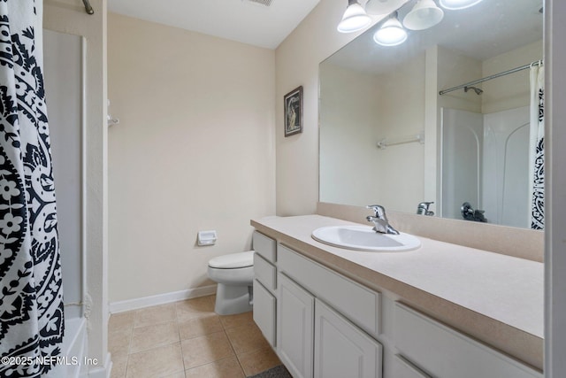 bathroom with tile patterned floors, vanity, and toilet