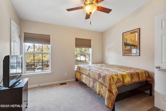 bedroom featuring ceiling fan and light colored carpet