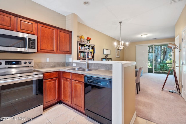 kitchen featuring pendant lighting, light carpet, an inviting chandelier, sink, and stainless steel appliances