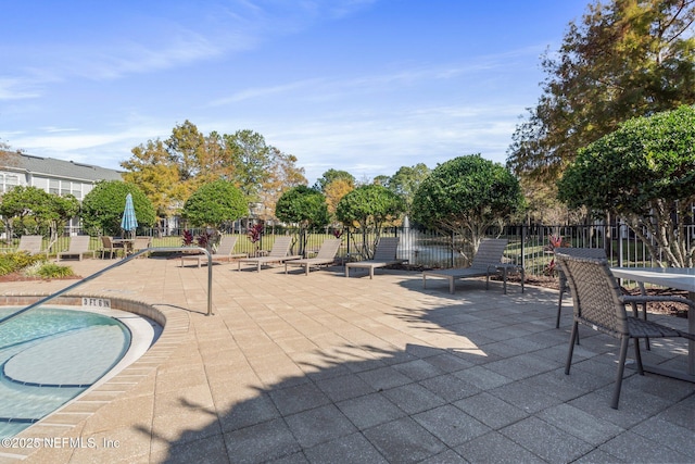 view of patio / terrace with a pool