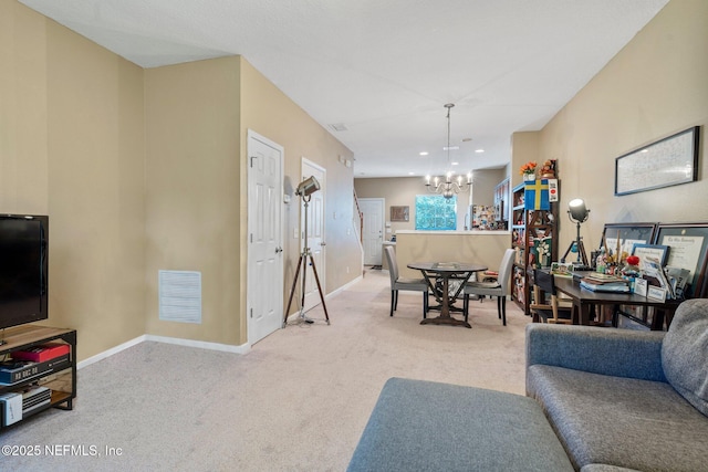 dining area featuring a chandelier and carpet