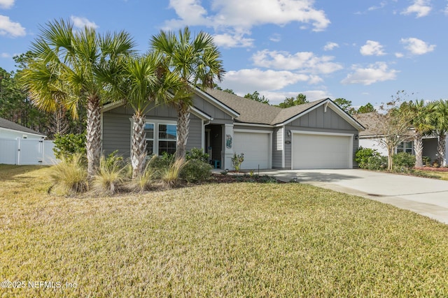 view of front of home featuring a front yard and a garage