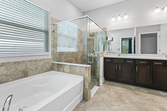 bathroom featuring plus walk in shower and vanity