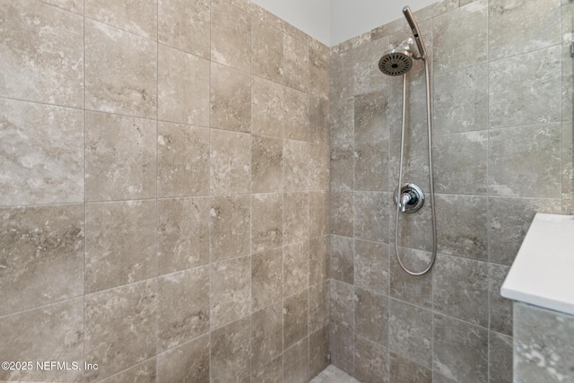 bathroom with tiled shower