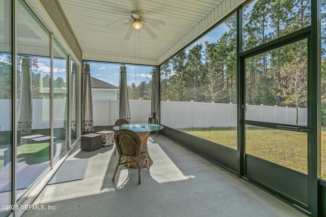 sunroom with ceiling fan and a wealth of natural light