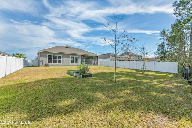 view of yard with a sunroom