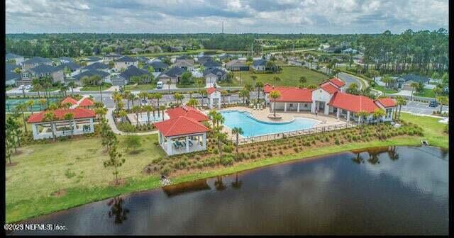 birds eye view of property featuring a water view