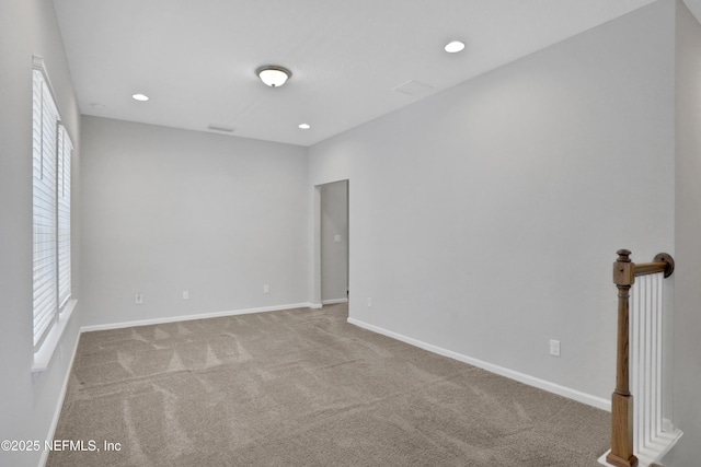 carpeted spare room with a wealth of natural light