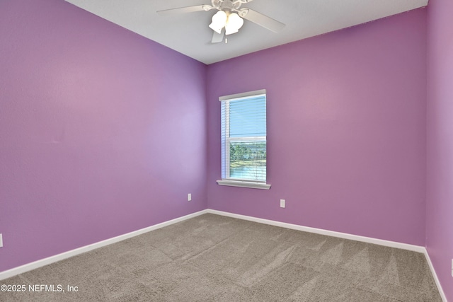 empty room featuring carpet and ceiling fan