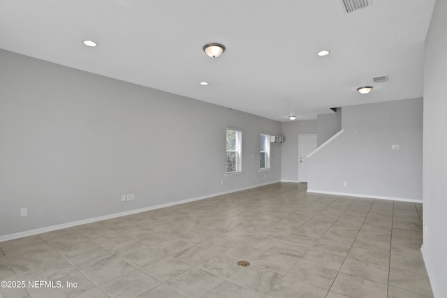 empty room with light tile patterned floors