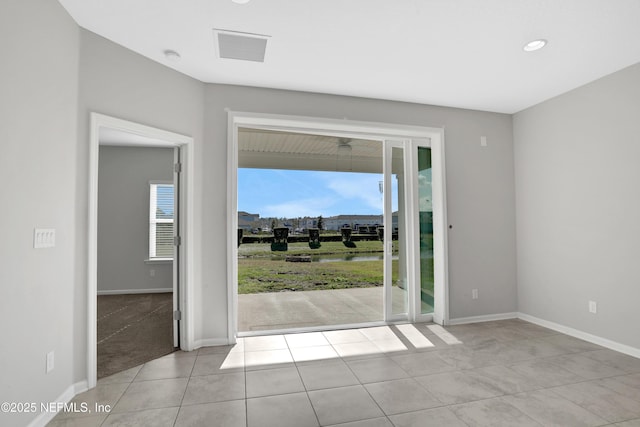 unfurnished room with light tile patterned floors