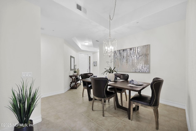 dining space featuring a notable chandelier and light tile patterned floors