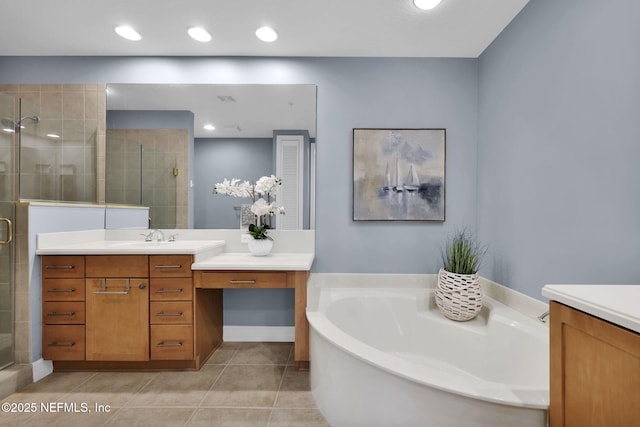 bathroom featuring tile patterned flooring, separate shower and tub, and vanity