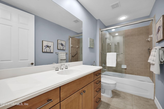 full bathroom featuring toilet, tile patterned flooring, shower / bath combination with glass door, and vanity