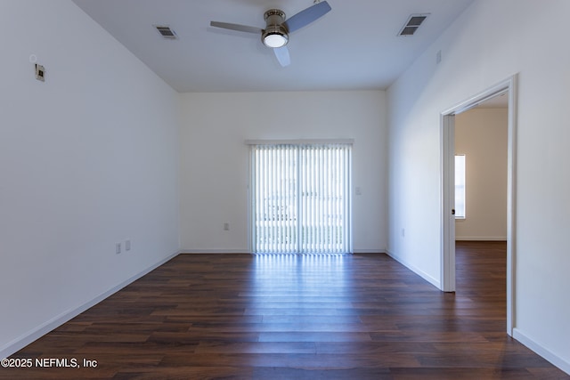 empty room featuring ceiling fan and dark wood-type flooring