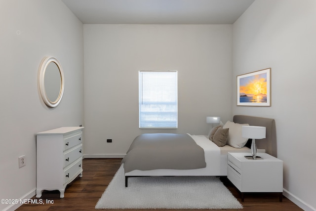 bedroom featuring dark hardwood / wood-style flooring