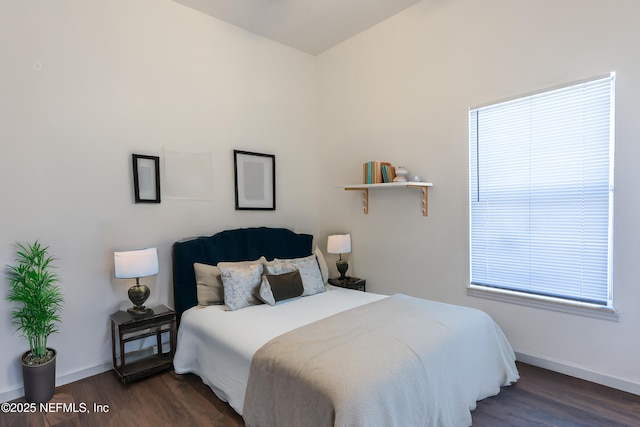 bedroom featuring dark wood-type flooring