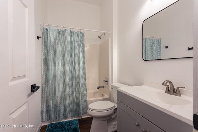 full bathroom with wood-type flooring, vanity, toilet, and shower / bath combo with shower curtain