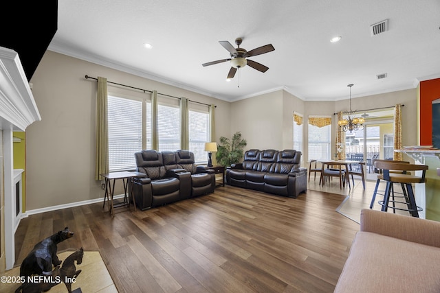 living room with dark wood-type flooring, visible vents, ornamental molding, and baseboards