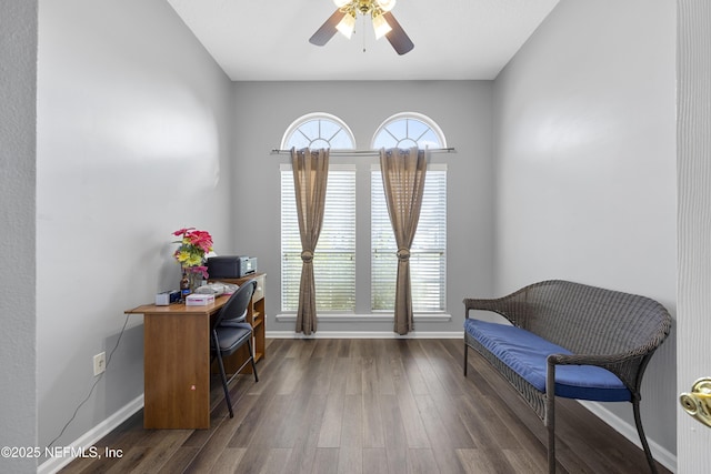 office with dark wood-type flooring, a ceiling fan, and baseboards