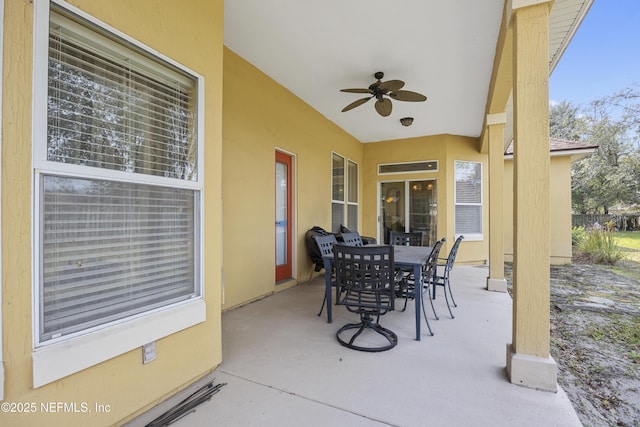 view of patio with a ceiling fan and outdoor dining space