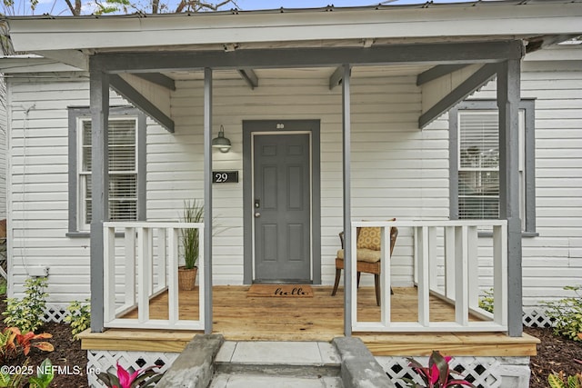 doorway to property with covered porch