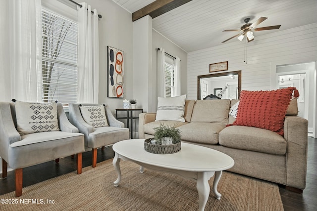 living room with wood ceiling, ceiling fan, wooden walls, hardwood / wood-style flooring, and vaulted ceiling with beams