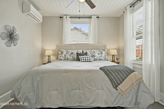 bedroom featuring a wall mounted AC, ceiling fan, and wooden ceiling