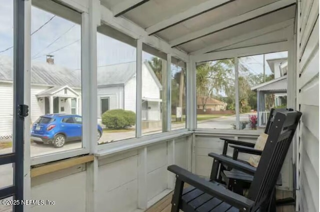 sunroom / solarium with vaulted ceiling