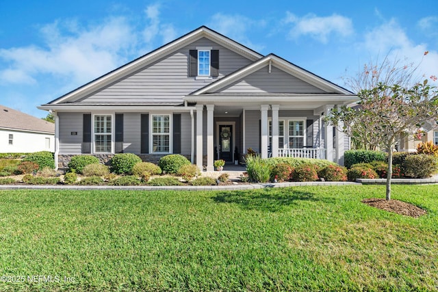 view of front of house featuring a front yard and a porch