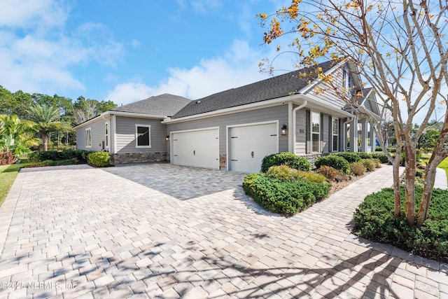 view of side of home featuring a garage