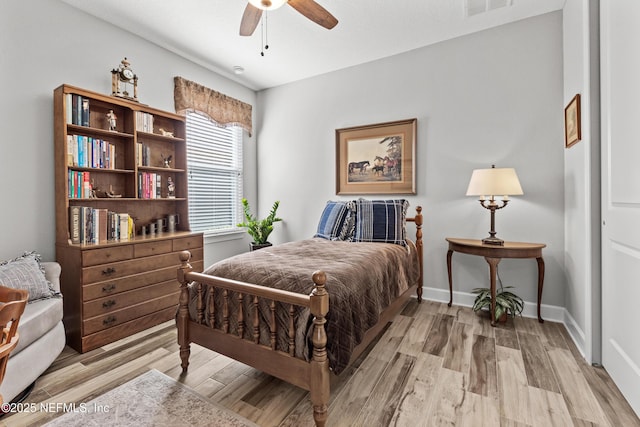 bedroom featuring ceiling fan and light hardwood / wood-style floors