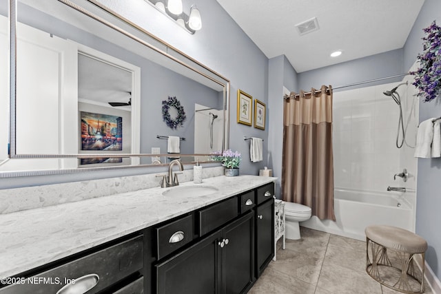 full bathroom with shower / bath combo, vanity, tile patterned floors, ceiling fan, and toilet