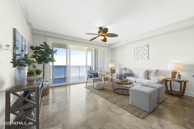 living room featuring ornamental molding and ceiling fan