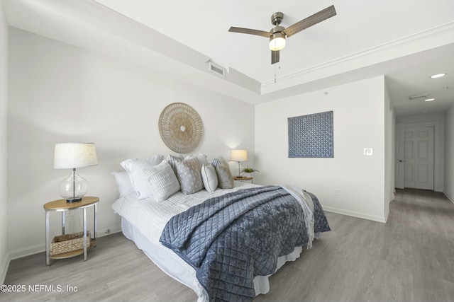 bedroom featuring light hardwood / wood-style flooring and ceiling fan