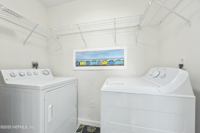 laundry area with independent washer and dryer